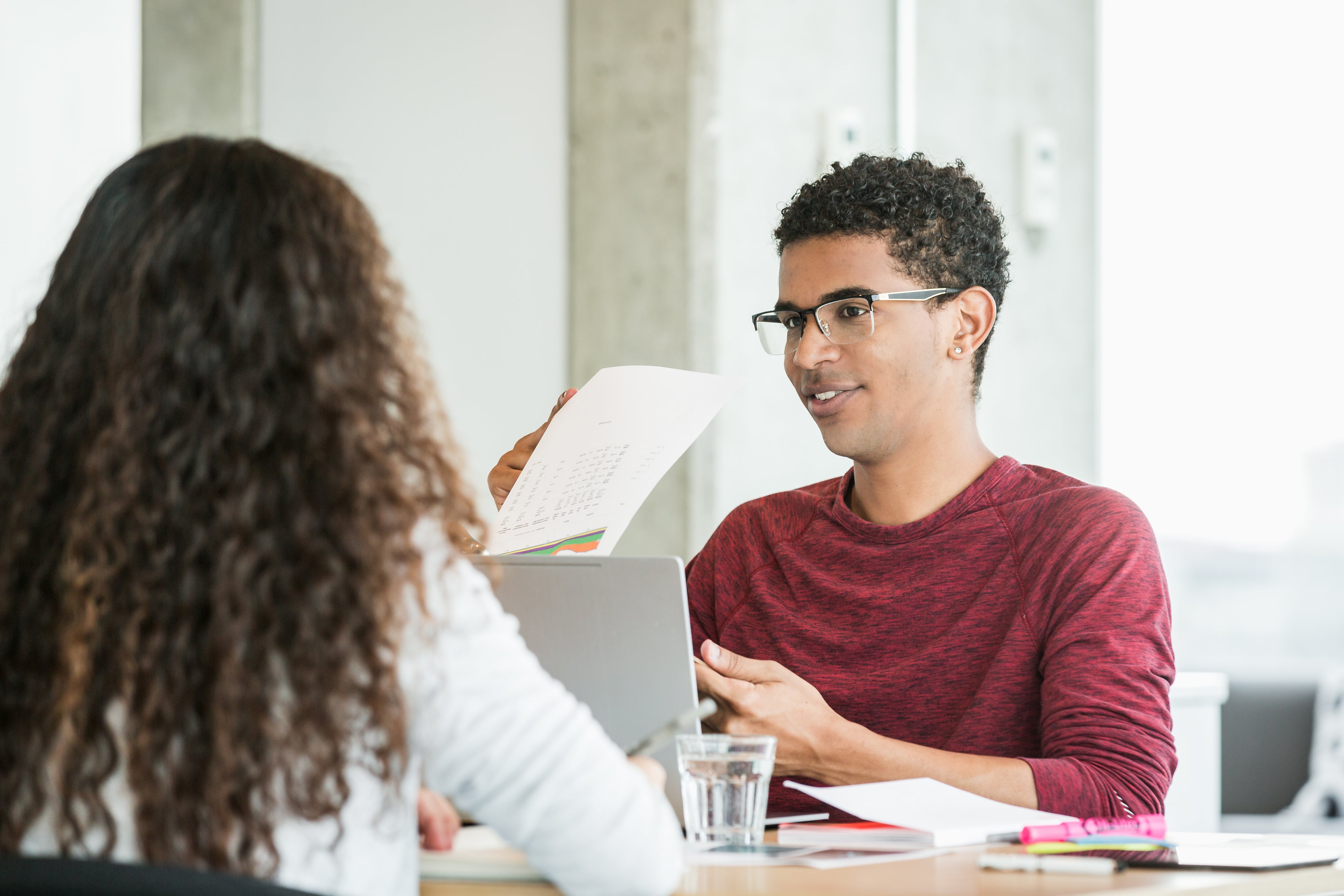 files/young-man-in-meeting-going-over-reports.jpg